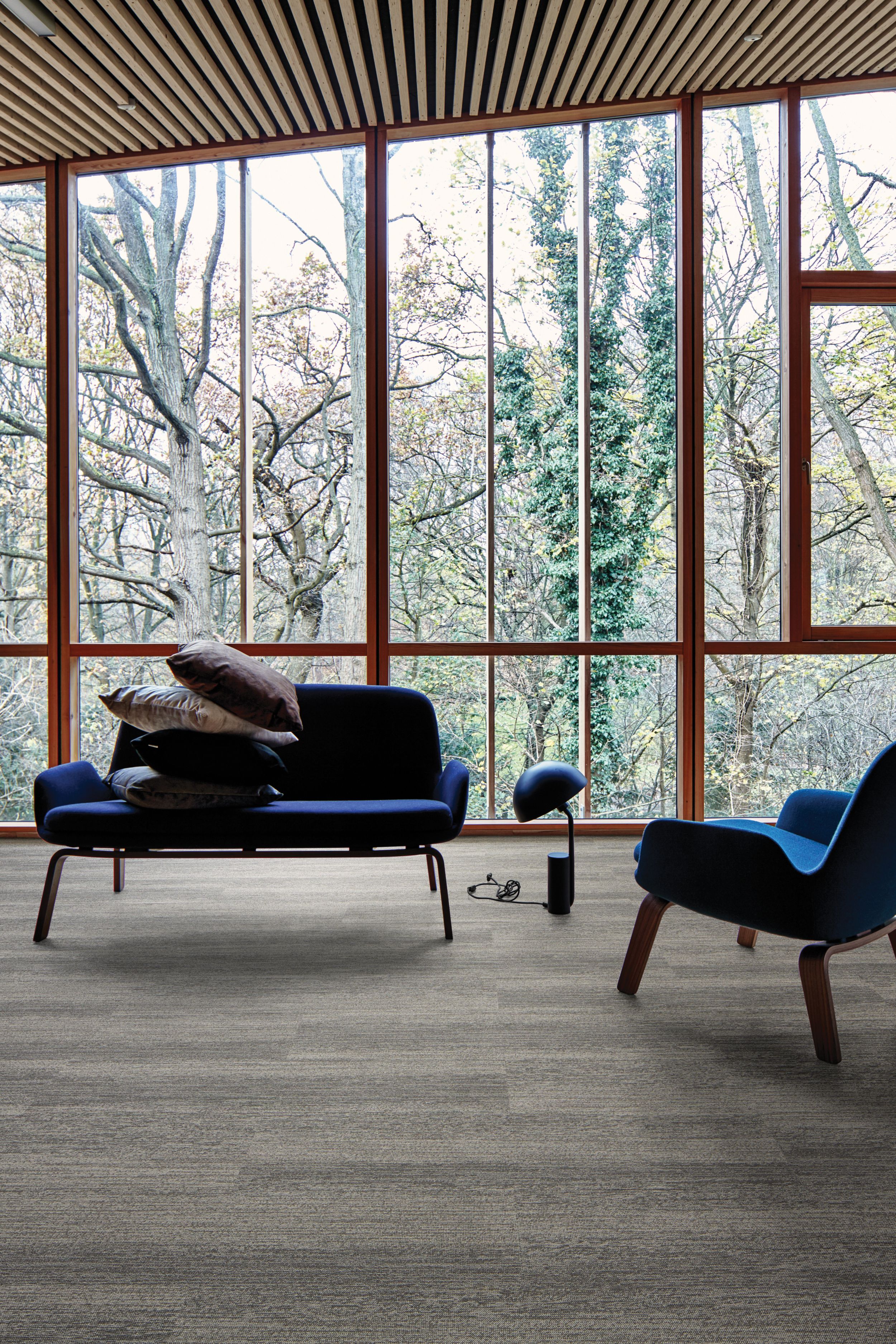 Interface Touch of Timber plank carpet tile in room with floor to ceiling windows, wood ceiling and blue sofa and chair numéro d’image 9